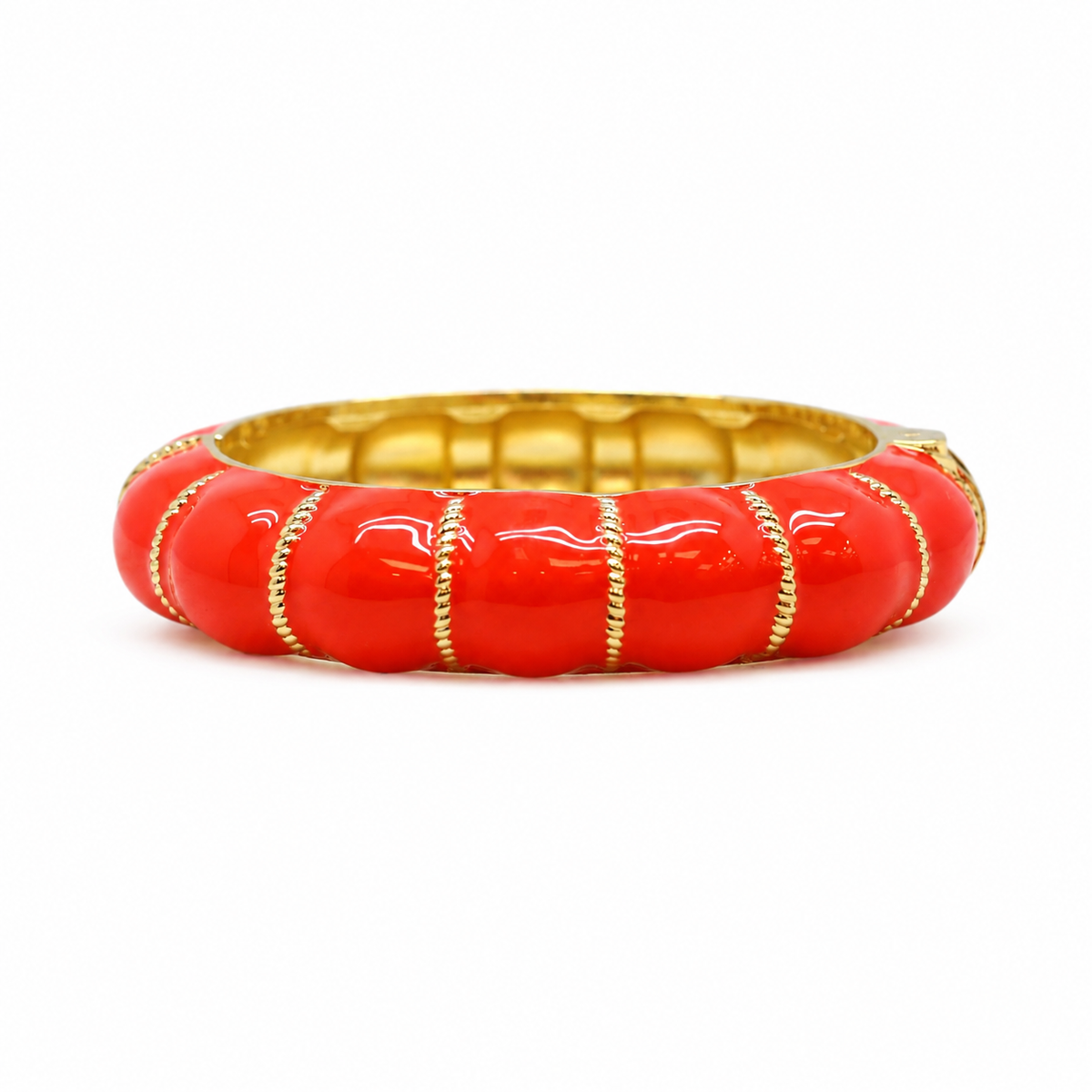Coral-lacquered gold brass statement bangle in bright orange-red — Artna Fiji