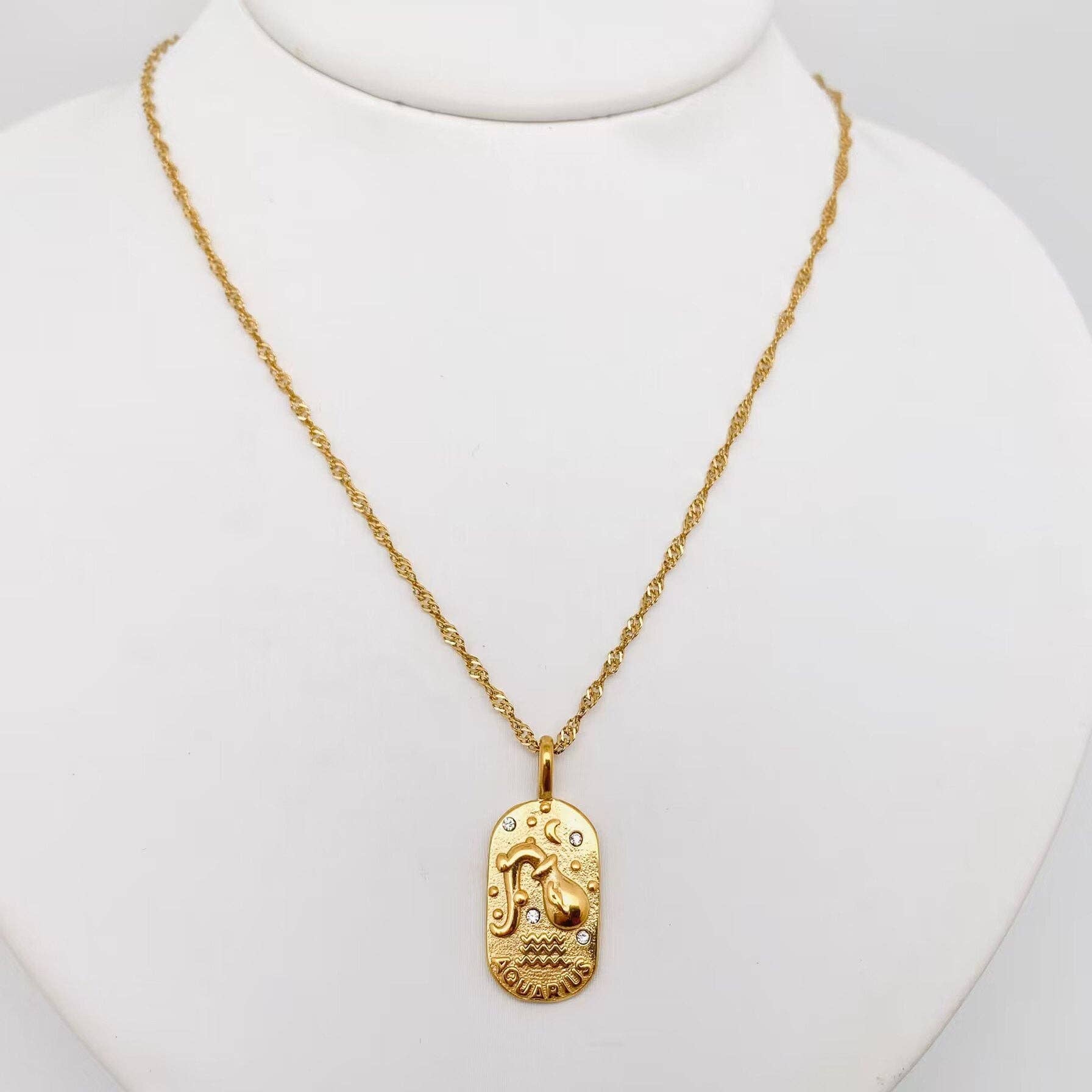 Aquarius constellation pendant necklace worn layered