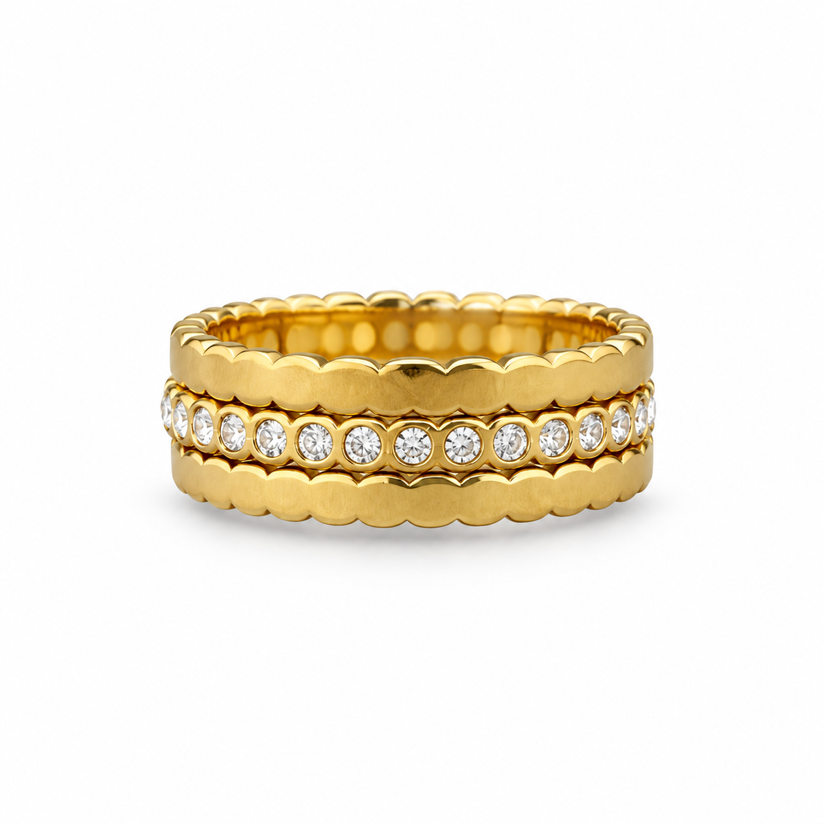 Set of three 18K gold-plated stacking rings — two scalloped bands framing a cubic zirconia eternity band