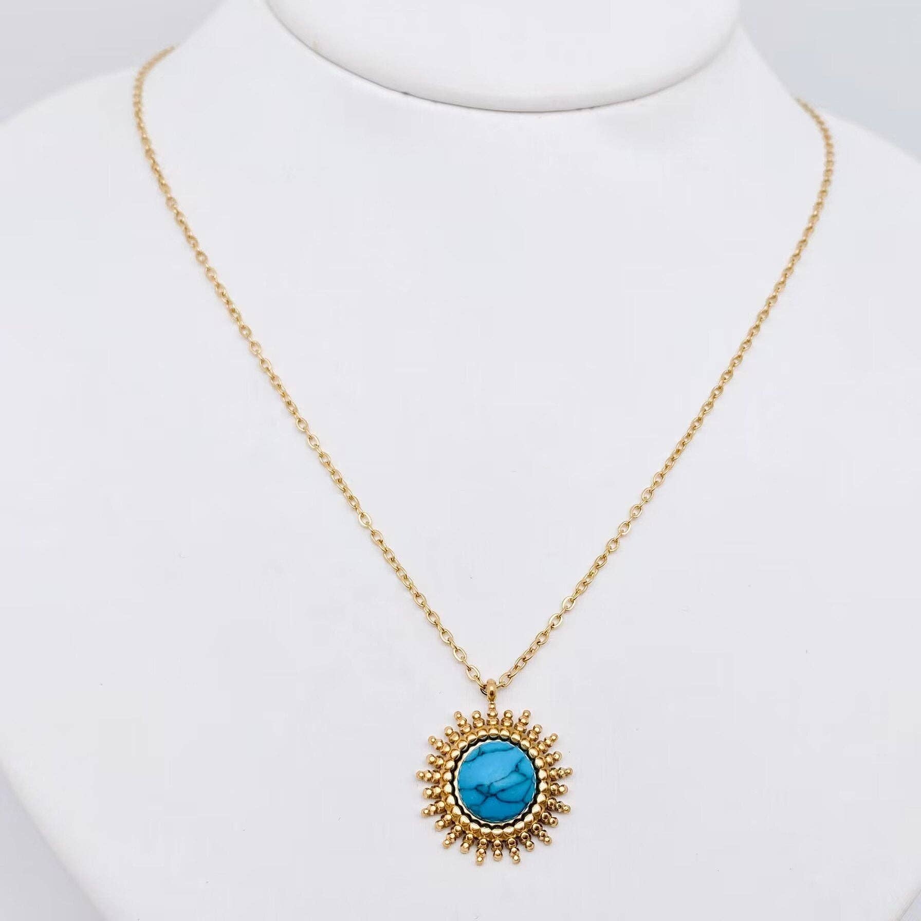 Gold-plated turquoise necklace with radiant pendant design
