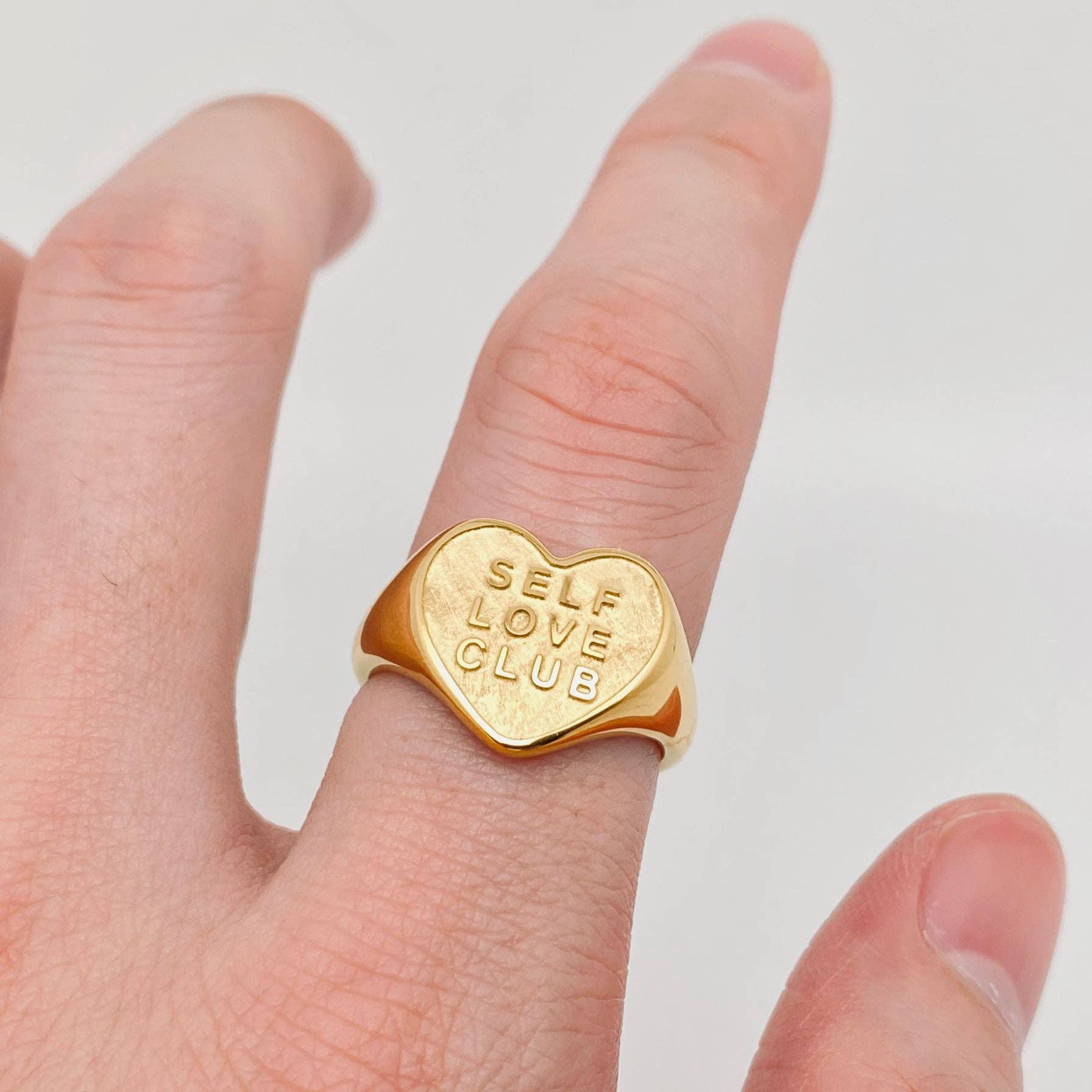 Sculptural heart ring in 18K gold-plated stainless steel worn on hand