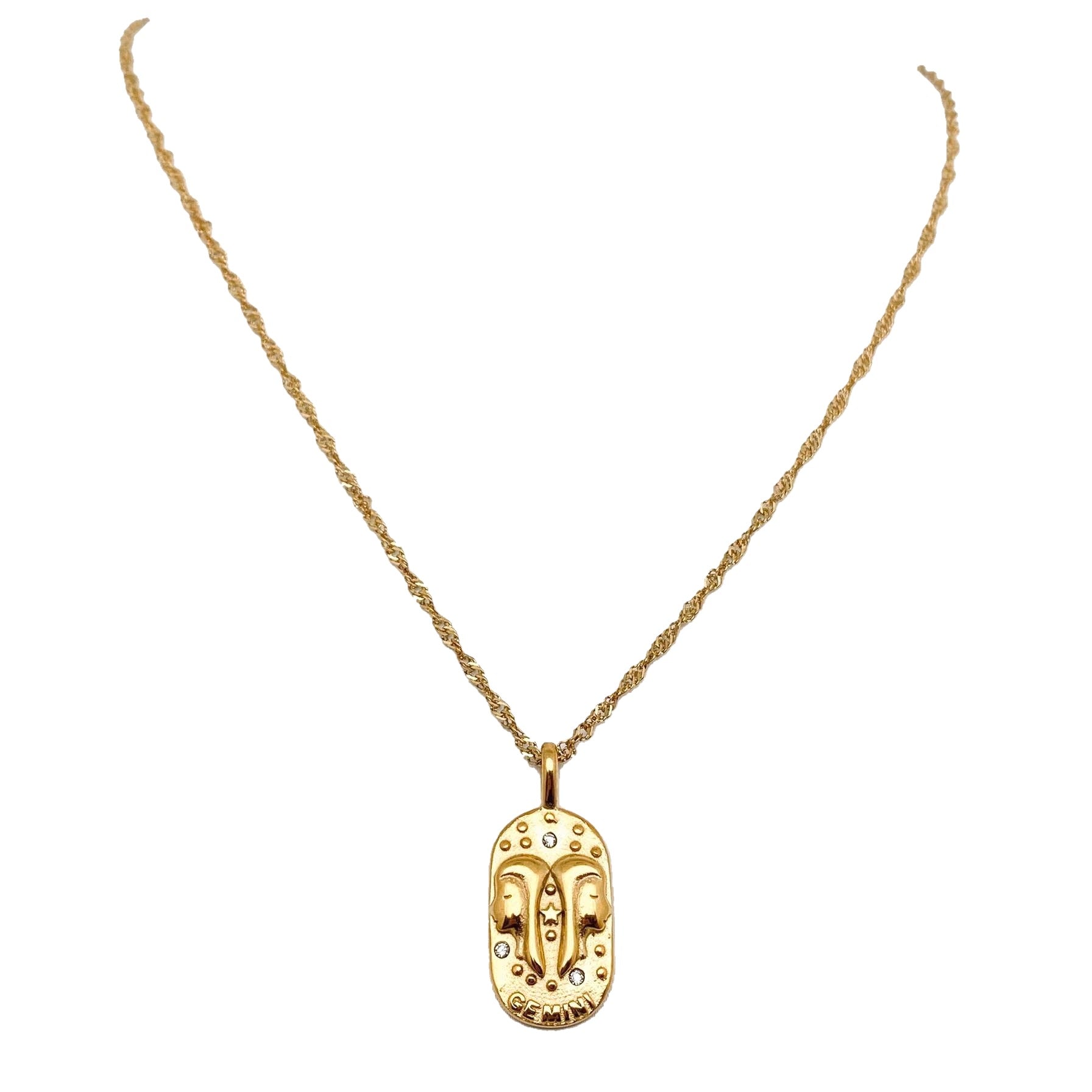 Gold necklace with a zodiac Gemini pendant on a white background