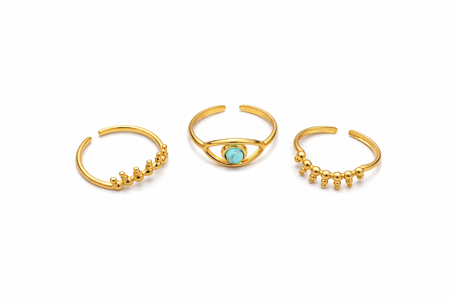 Gold evil eye stacked ring with symbolic protection motif