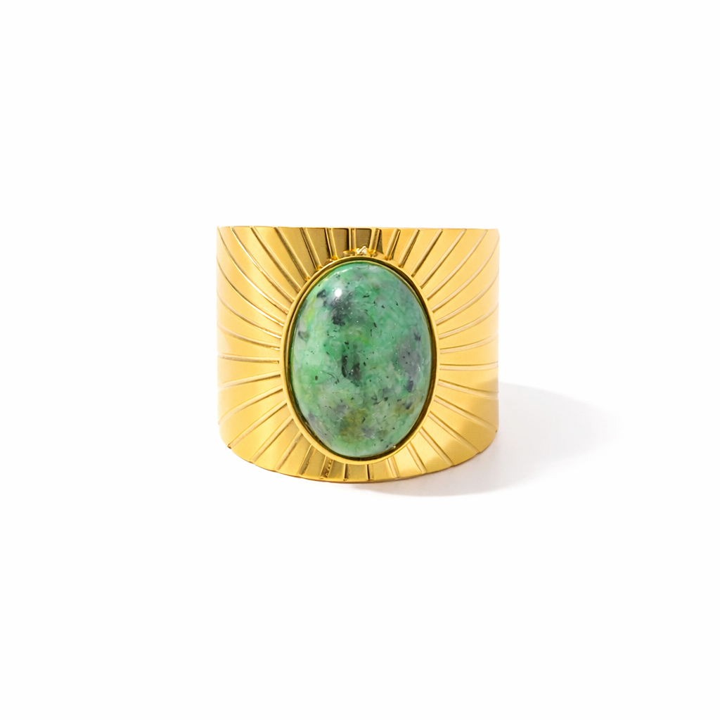 Vintage-inspired gold-plated ring featuring an oval natural stone inlay with textured sculptural detailing.