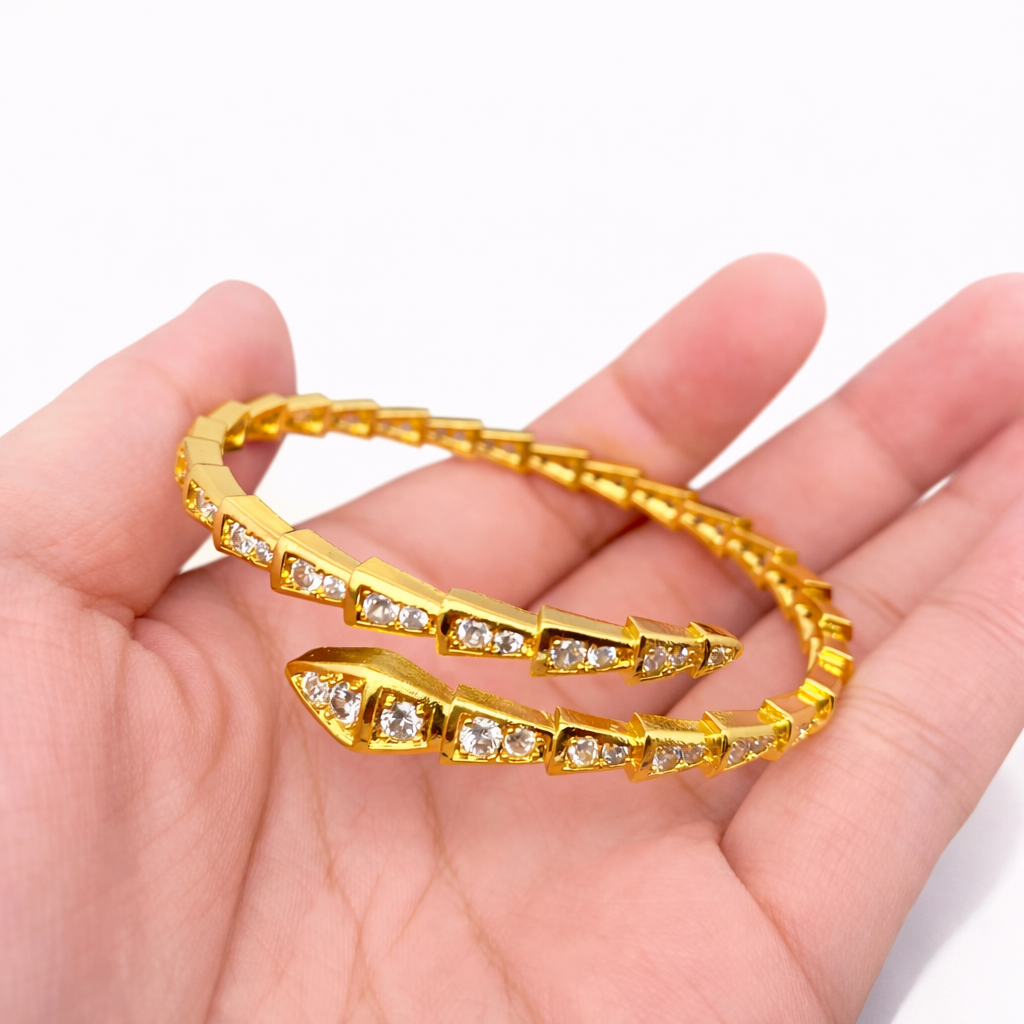 Gold snake bangle with cubic zirconia details