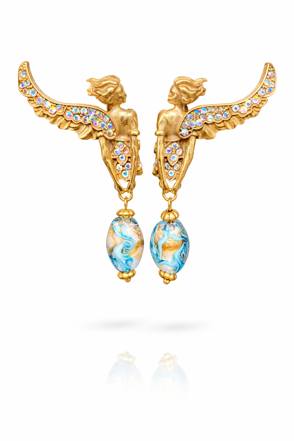 Vintage angel wing statement earrings with rhinestones, delicate glaze detailing, and ear clip design in warm gold tones.